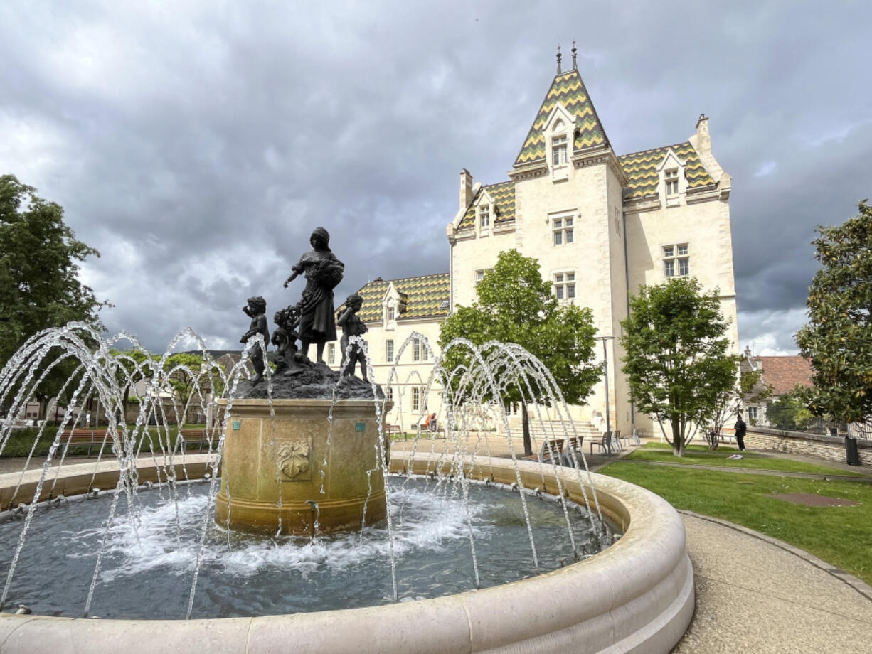 A fountain appears in the village of Meursault on the Voie des Vignes, in the Burgundy region of France.