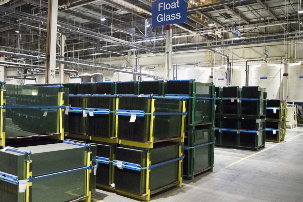 Stacks of glass panes are shown during a grand opening tour of the Fuyao Glass America plant, Friday, Oct. 7, 2016, in Moraine, Ohio. The Chinese automotive glass maker said the company was not the target of a federal investigation that last week temporarily shut down production at its Ohio plant, which was the subject of the Netflix film &ldquo;American Factory&rdquo; that won an Oscar in 2020.   Fuyao Glass America said it was told by authorities that a third party employment company was at the center of the criminal investigation, according to a filing with the Shanghai Stock Exchange.