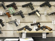 Guns for sale are displayed at Maxon Shooter&rsquo;s Supplies in Des Plaines, Ill., Tuesday, June 25, 2024. A new national divide is emerging among states over whether to track sales by gun stores. A California law taking effect Monday will require credit card networks to provide banks with special retail codes to assign to gun stores. By contrast, new laws taking effect in Georgia, Iowa, Tennessee and Wyoming will prohibit the use of special gun shop codes in financial transactions. A total of 17 states have passed some sort of limit on category codes for gun retailers, while California has been joined by Colorado and New York.