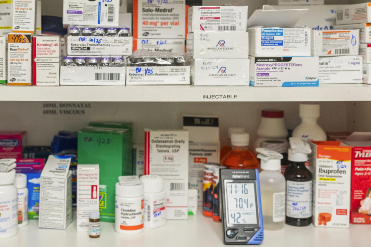 FILE - Temperature and humidity are monitored in a medicine cabinet at a medical center in California on Wednesday, May 29, 2024. Extreme heat can raise the danger of heat-related illnesses and threaten health in a more subtle way &mdash; by amplifying the side effects of many common medications. Hot weather, too, can damage medicines such as insulin that require refrigeration. Inhalers can explode. Epinephrine injectors such as EpiPens can malfunction. Meds delivered in the mail can deteriorate.