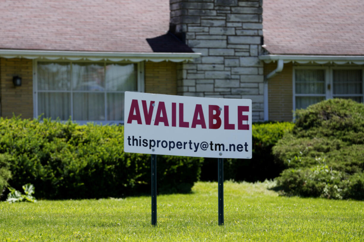 FILE - A sign announcing the availability of a home is displayed in Rolling Meadows, Ill., June 10, 2024. On Tuesday, July 23, 2024, the National Association of Realtors reports on existing home sales for June. (AP Photo/Nam Y.