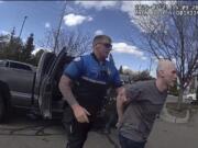 FILE - In this photo made from body camera footage and released by the Twin Falls, Idaho, Police Department, Skylar Meade, right, is arrested in Twin Falls on Thursday, March 21, 2024. An Idaho inmate who slipped state custody at a Boise hospital after the corrections officers guarding him were violently attacked is expected to be sentenced for escape Friday morning.