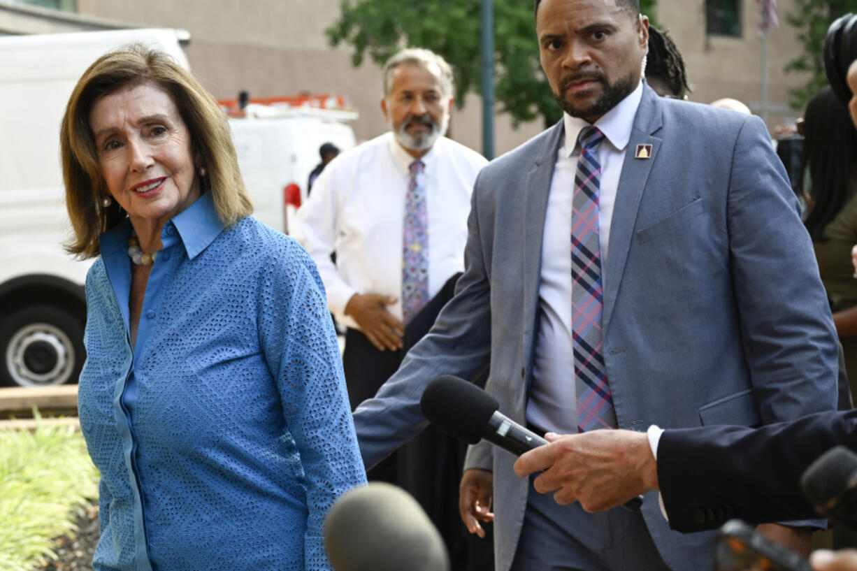 Rep. Nancy Pelosi, D-Calif., the speaker emerita, left, arrives at the Democratic National Headquarters with other Democratic members of the House of Representatives to discuss the future of President Biden running for the presidency, Tuesday, July 9, 2024 in Washington.