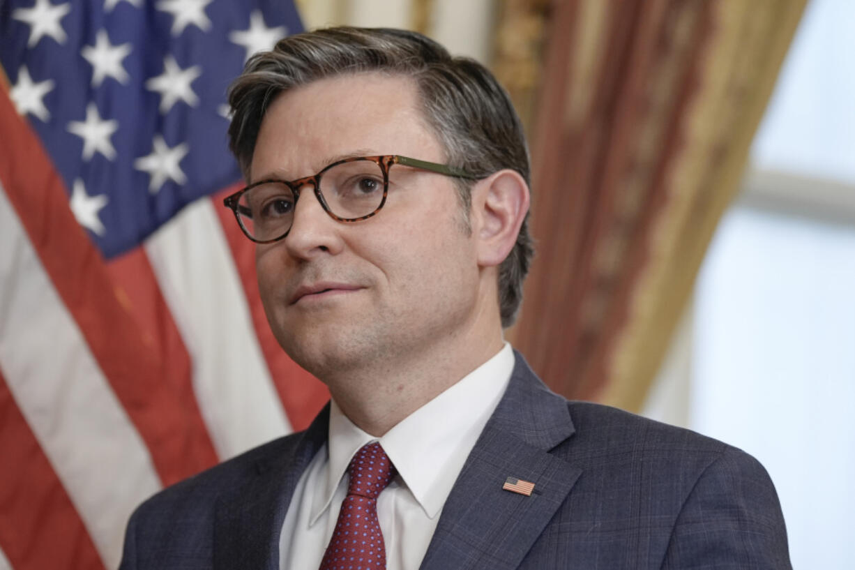 Speaker of the House Mike Johnson, R-La., participates in a ceremonial swearing-in for Rep. Michael Rulli, R-Ohio, on Capitol Hill Tuesday, June 25, 2024, in Washington.