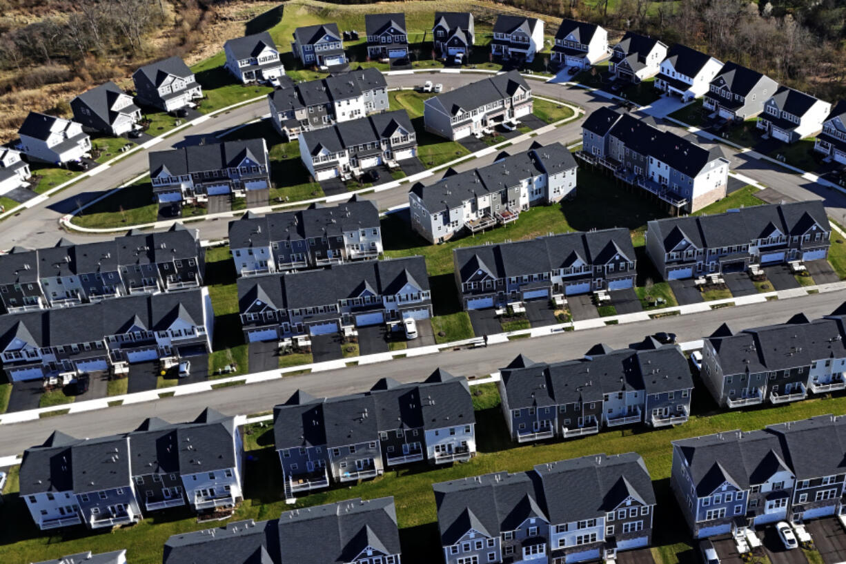 FILE - A housing development in Cranberry Township, Pa., is shown on March 29, 2024. The nation&rsquo;s housing market sales slump is dragging on into its third straight year, as evidenced by another weak spring home buying season. (AP Photo/Gene J.