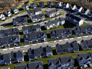 FILE - A housing development in Cranberry Township, Pa., is shown on March 29, 2024. The nation&rsquo;s housing market sales slump is dragging on into its third straight year, as evidenced by another weak spring home buying season. (AP Photo/Gene J.