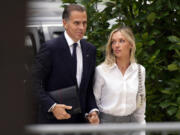 FILE &mdash; Hunter Biden arrives at federal court with his wife, Melissa Cohen Biden, June 11, 2024, in Wilmington, Del.