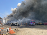 Port Fire & Rescue battled a blaze at a recycling plant that sent a plume of smoke drifting over the Columbia River Tuesday.