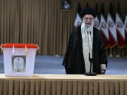 Iranian Supreme Leader Ayatollah Ali Khamenei speaks after casting his vote for the presidential runoff election in Tehran, Iran, Friday, July 5, 2024. Iranians are voting in a runoff election to replace the late President Ebrahim Raisi, who was killed in a May helicopter crash in the country&rsquo;s northwest along with the foreign minister and several other officials.