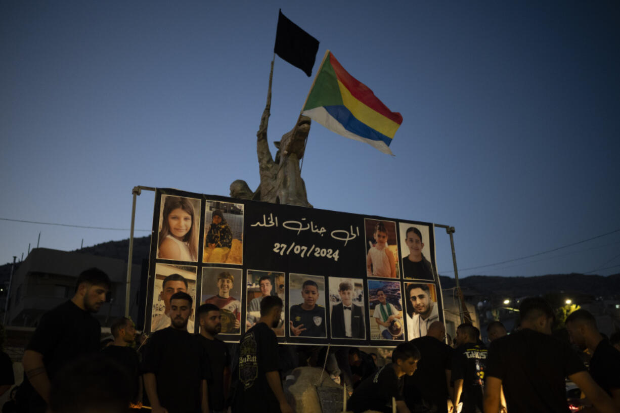 Photos of the children and teens killed in a rocket strike at a soccer field, are displayed at a roundabout as people light candles in their memories, at the village of Majdal Shams, in the Israeli-annexed Golan Heights, Sunday, July 28, 2024. A rocket strike at a soccer field in the village has killed at least 12 children and teens. It&#039;s the deadliest strike on an Israeli target along the country&#039;s northern border since the fighting between Israel and the Lebanese militant group Hezbollah began.