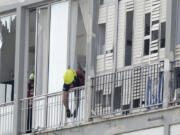 An Israeli firefighter investigates the scene of a deadly explosion in Tel Aviv, Israel, Friday, July 19, 2024.