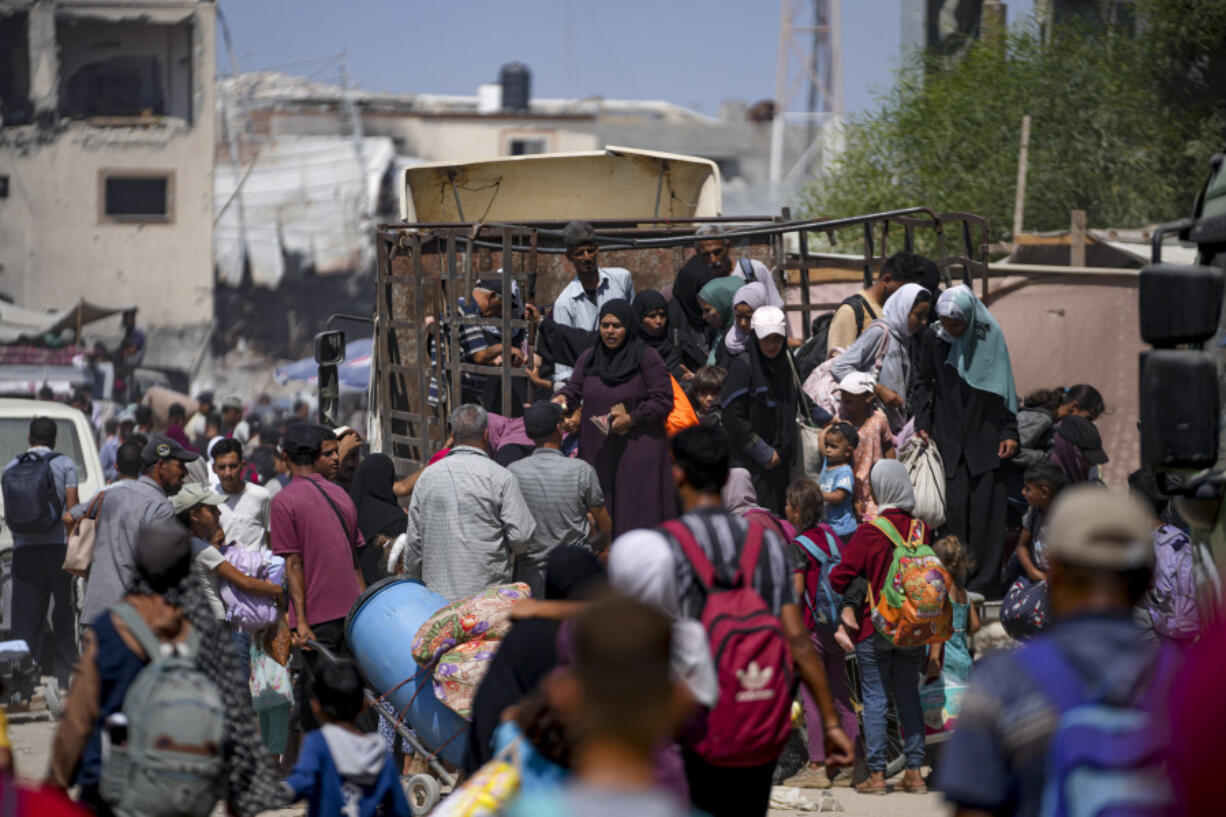 Palestinians displaced by the Israeli air and ground offensive on the Gaza Strip flee from parts of Khan Younis following an evacuation order by the Israeli army to leave the eastern part of Gaza Strip&rsquo;s second largest city, Monday, July 22, 2024.