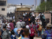 Palestinians displaced by the Israeli air and ground offensive on the Gaza Strip flee from parts of Khan Younis following an evacuation order by the Israeli army to leave the eastern part of Gaza Strip&rsquo;s second largest city, Monday, July 22, 2024.