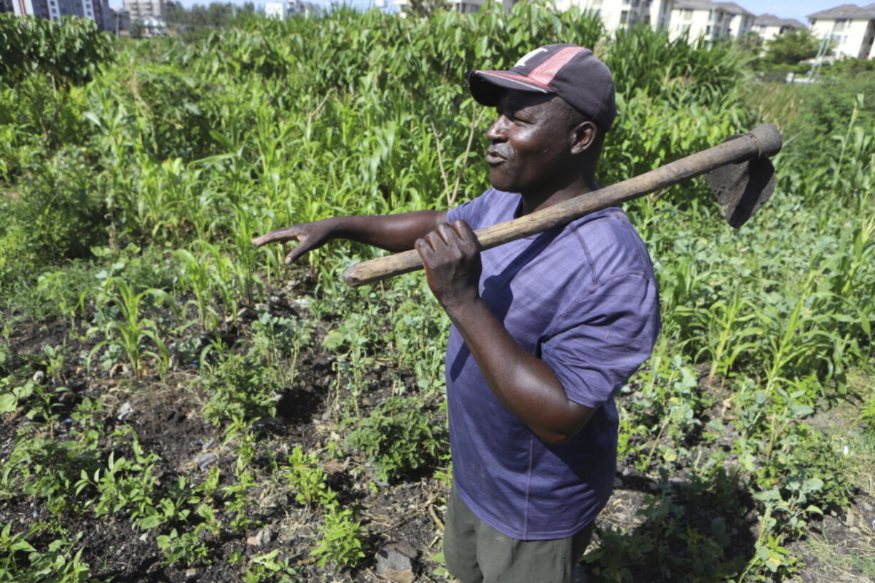 Benson Wanjala talks about the health of his soil at his farm in Machakos, Kenya, Tuesday, May 21, 2024.