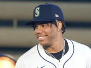 Jurrangelo Cijntje smiles after being selected 15th overall by the Seattle Mariners in the first round of the MLB baseball draft in Fort Worth, Texas, Sunday, July 14, 2024.