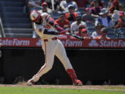 Los Angeles Angels&#039; Jo Adell hits a three-run home run during the eighth inning of a baseball game against the Seattle Mariners Sunday, July 14, 2024, in Anaheim, Calif. (AP Photo/Mark J.