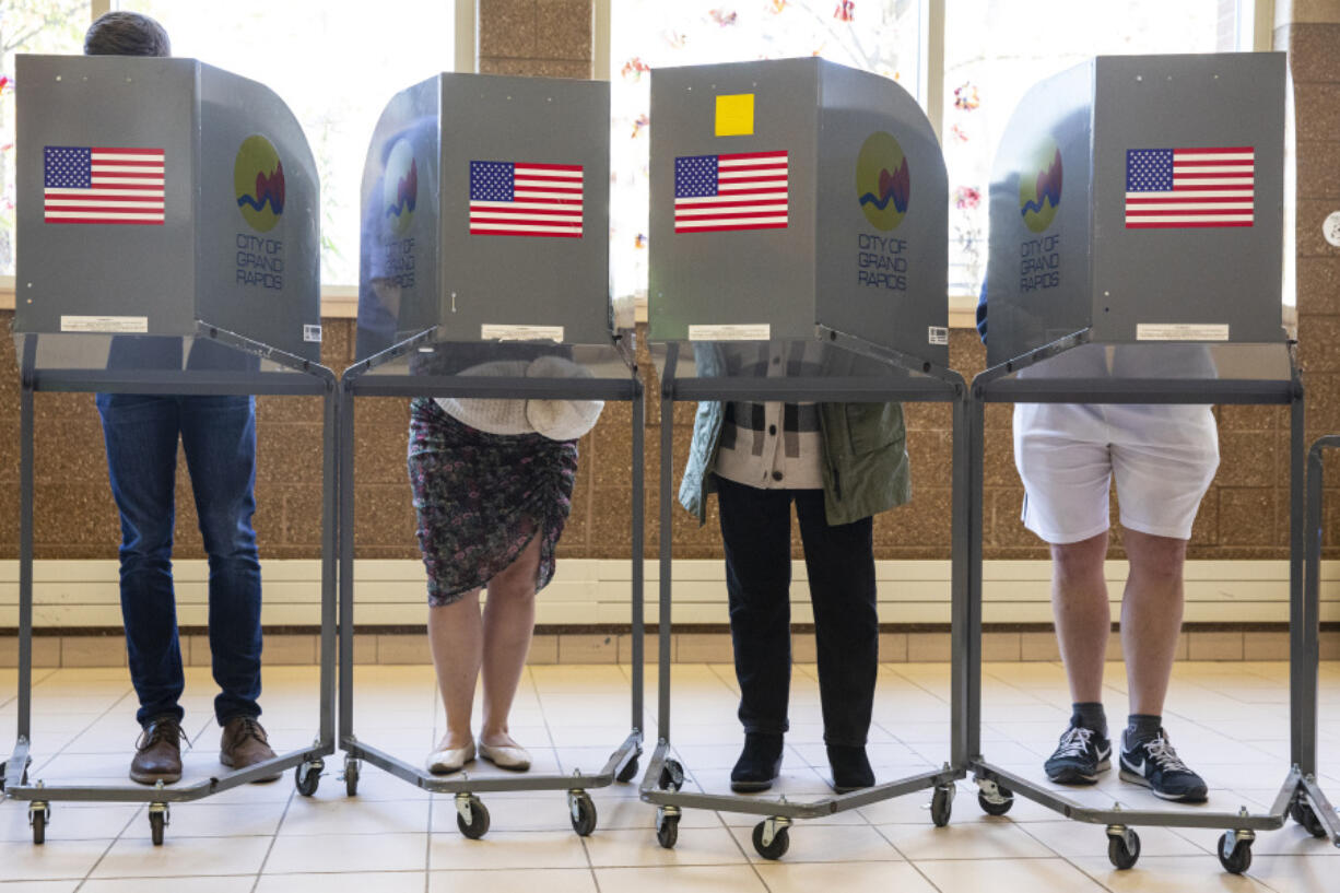 FILE - Voters cast their ballots at Coit Arts Academy in Grand Rapids, Mich., Nov. 8, 2022. The Associated Press announced Thursday, July 11, 2024, that it will provide free campaign and election night coverage to dozens of small and independent newsrooms located in swing states, such as Michigan.