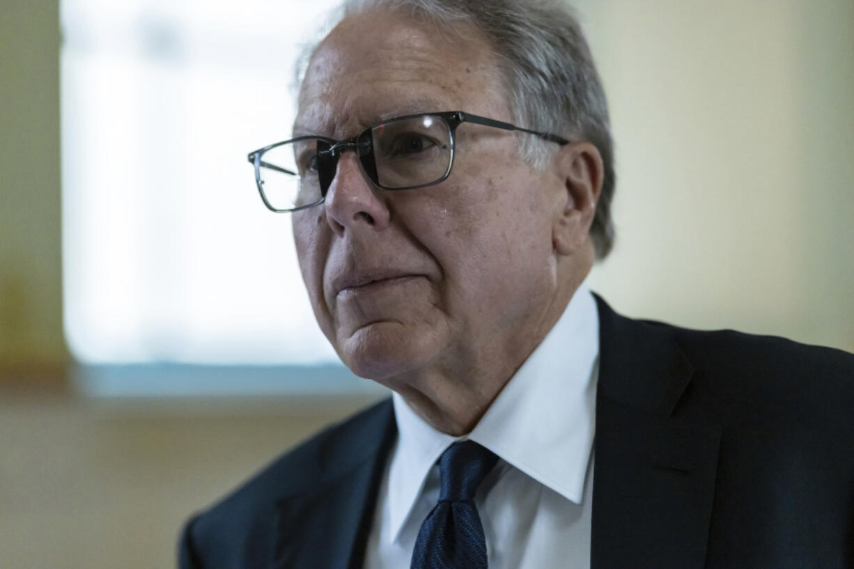 FILE - Wayne LaPierre, former CEO of the National Rifle Association walks in the hallway at civil court in New York, Monday, July 15, 2024.