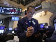 Trader Gregory Rowe works on the floor of the New York Stock Exchange, Monday, July 22, 2024.   After getting trounced by their larger rivals for years, some of the smallest stocks on Wall Street have shown much more life recently.