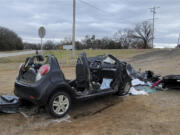 FILE - In this image provided by KFOR-TV, a heavily damaged vehicle is seen off a road in Tishomingo, Okla., following a two-vehicle collision in which six teenage students were killed, March 22, 2022. The crash has the National Transportation Safety Board urging parents to warn teenagers about the risk of driving after using marijuana.