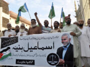 Supporters of the Pakistani religious group &ldquo;Jamaat-e-Islami&rdquo; hold a poster of Hamas leader Ismail Haniyeh during a protest to condemn his killing, in Hyderabad, Pakistan, Wednesday, July 31, 2024. Haniyeh was assassinated in Tehran, Iran&rsquo;s paramilitary Revolutionary Guard said early Wednesday.