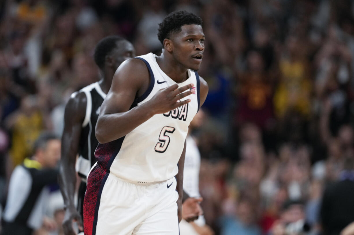 Anthony Edwards, of the United States, reacts after a three against South Sudan in a men&#039;s basketball game at the 2024 Summer Olympics, Wednesday, July 31, 2024, in Villeneuve-d&#039;Ascq, France. (AP Photo/Mark J.