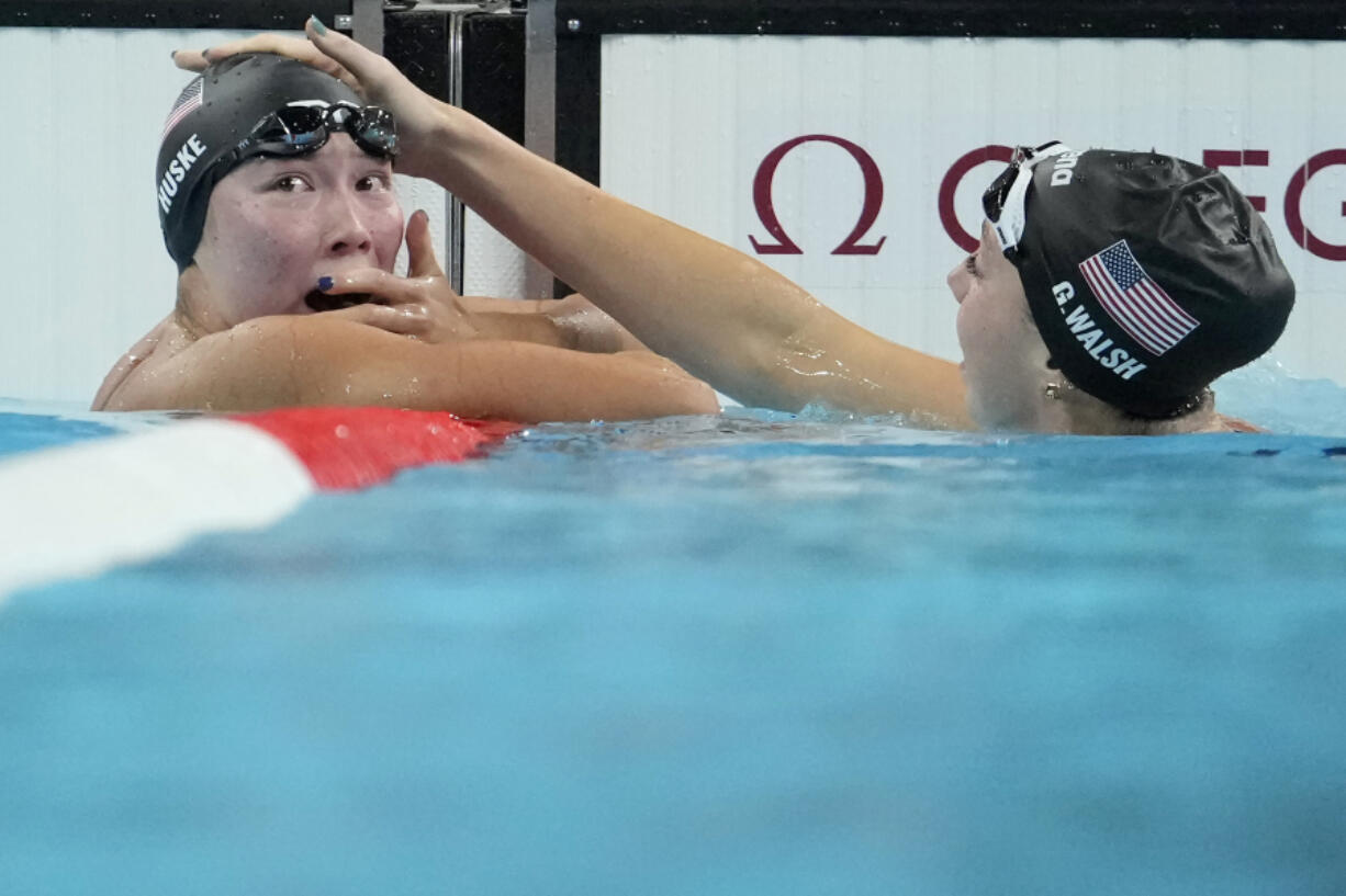 Torri Huske, left, of the United States, reacts after winning the women&#039;s 100-meter butterfly final with teammate Gretchen Walsh at the 2024 Summer Olympics, Sunday, July 28, 2024, in Nanterre, France.