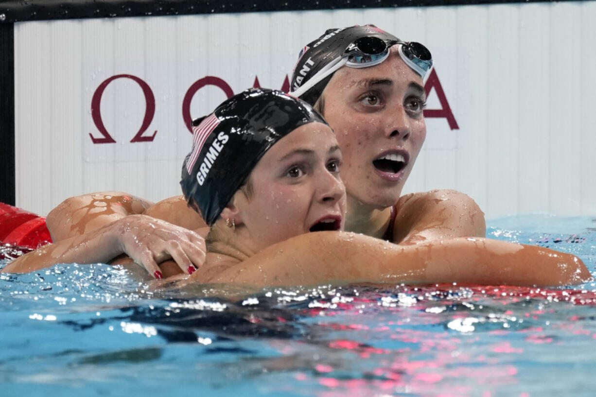 Summer McIntosh, of Canada, hugs Katie Grimes, of the United States, after winning the women&#039;s 400-meter individual medley final at the 2024 Summer Olympics, Monday, July 29, 2024, in Nanterre, France.