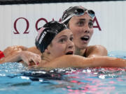 Summer McIntosh, of Canada, hugs Katie Grimes, of the United States, after winning the women&#039;s 400-meter individual medley final at the 2024 Summer Olympics, Monday, July 29, 2024, in Nanterre, France.