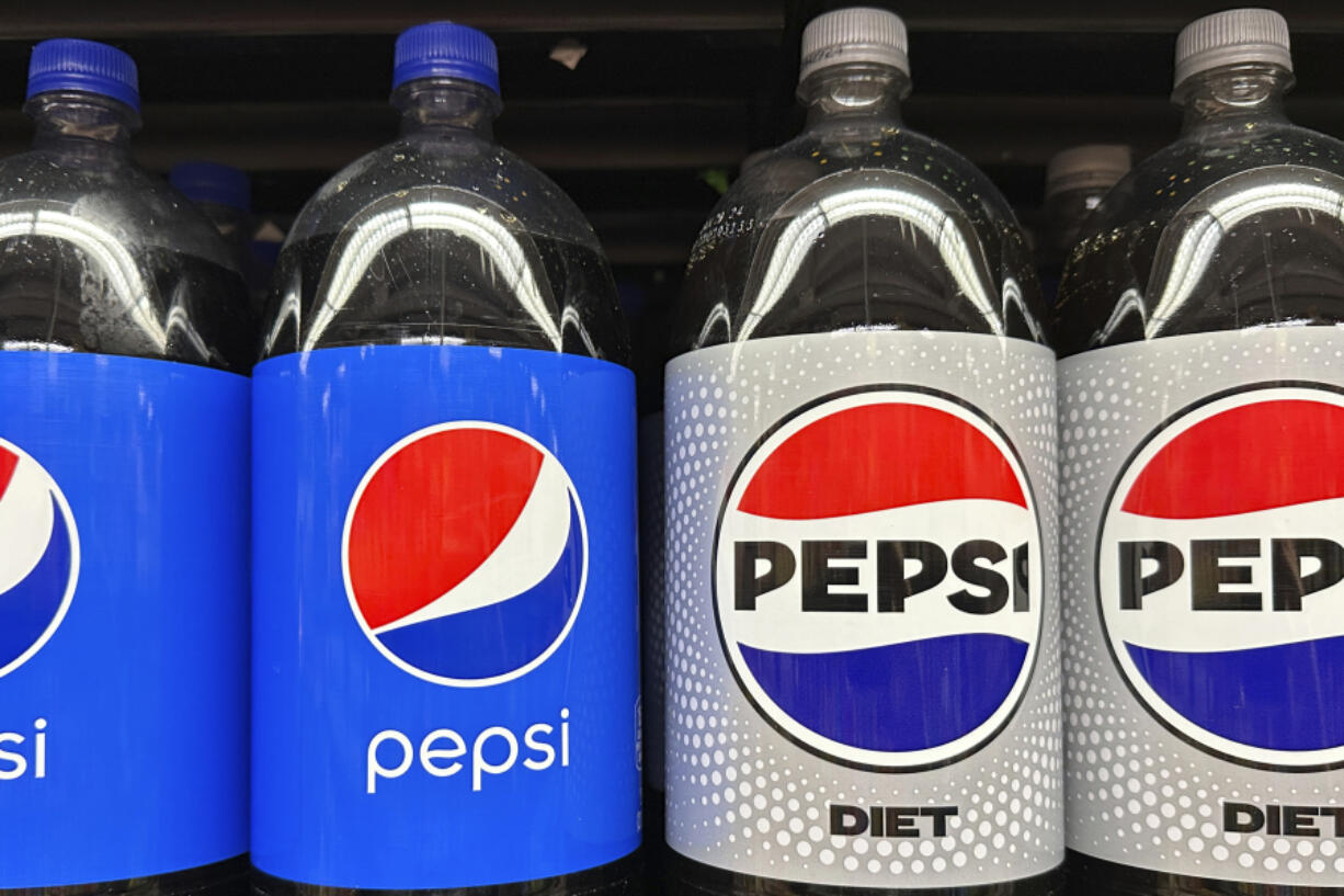 FILE - Plastic bottles of Pepsi are displayed at a grocery store in New York on Nov. 15, 2023. PepsiCo reported second quarter earnings results on Thursday, July 11, 2024. PepsiCo has leaned heavily into price increases over the past two years as its costs for ingredients and packaging rose. The fourth quarter of 2023 was the company&rsquo;s eighth straight quarter of double-digit percentage price increases.