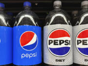 FILE - Plastic bottles of Pepsi are displayed at a grocery store in New York on Nov. 15, 2023. PepsiCo reported second quarter earnings results on Thursday, July 11, 2024. PepsiCo has leaned heavily into price increases over the past two years as its costs for ingredients and packaging rose. The fourth quarter of 2023 was the company&rsquo;s eighth straight quarter of double-digit percentage price increases.