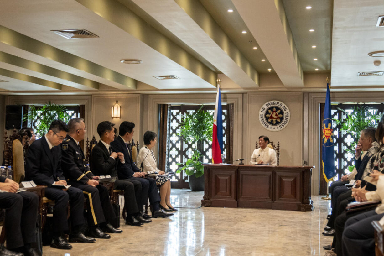 Philippine President Ferdinand Marcos Jr. meets with Japan Foreign Minister Yoko Kamikawa and Japan Defence Minister Minoru Kihara, during a courtesy call at the Malacanang Palace in Manila, Philippines, Monday, July 8, 2024.