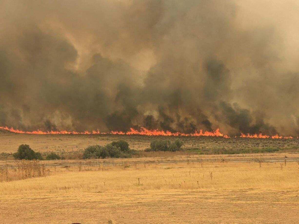 The Durkee Fire, seen here at the Huntington Exit off Interstate 84 in eastern Oregon, is burning on 244,842 acres as of Wednesday afternoon.