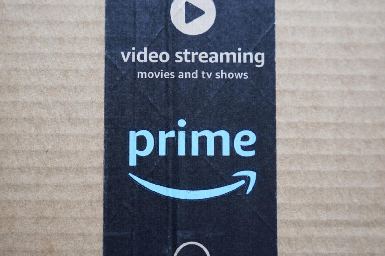 FILE - An Amazon Prime cardboard shipping box label is seen on March 17, 2023, in East Derry, N.H. Amazon Prime Day is here. And experts are reminding consumers to be wary of scams.