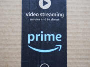 FILE - An Amazon Prime cardboard shipping box label is seen on March 17, 2023, in East Derry, N.H. Amazon Prime Day is here. And experts are reminding consumers to be wary of scams.