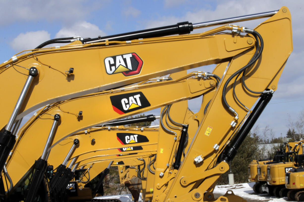 FILE - Excavator booms, adorned with the Caterpillar Inc. &ldquo;CAT&rdquo; logo, are displayed at the Milton CAT dealership in Londonderry, N.H., Feb. 20, 2020. On Friday, July 12, 2024, the Labor Department releases producer prices data for June, 2024.