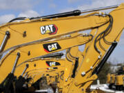 FILE - Excavator booms, adorned with the Caterpillar Inc. &ldquo;CAT&rdquo; logo, are displayed at the Milton CAT dealership in Londonderry, N.H., Feb. 20, 2020. On Friday, July 12, 2024, the Labor Department releases producer prices data for June, 2024.