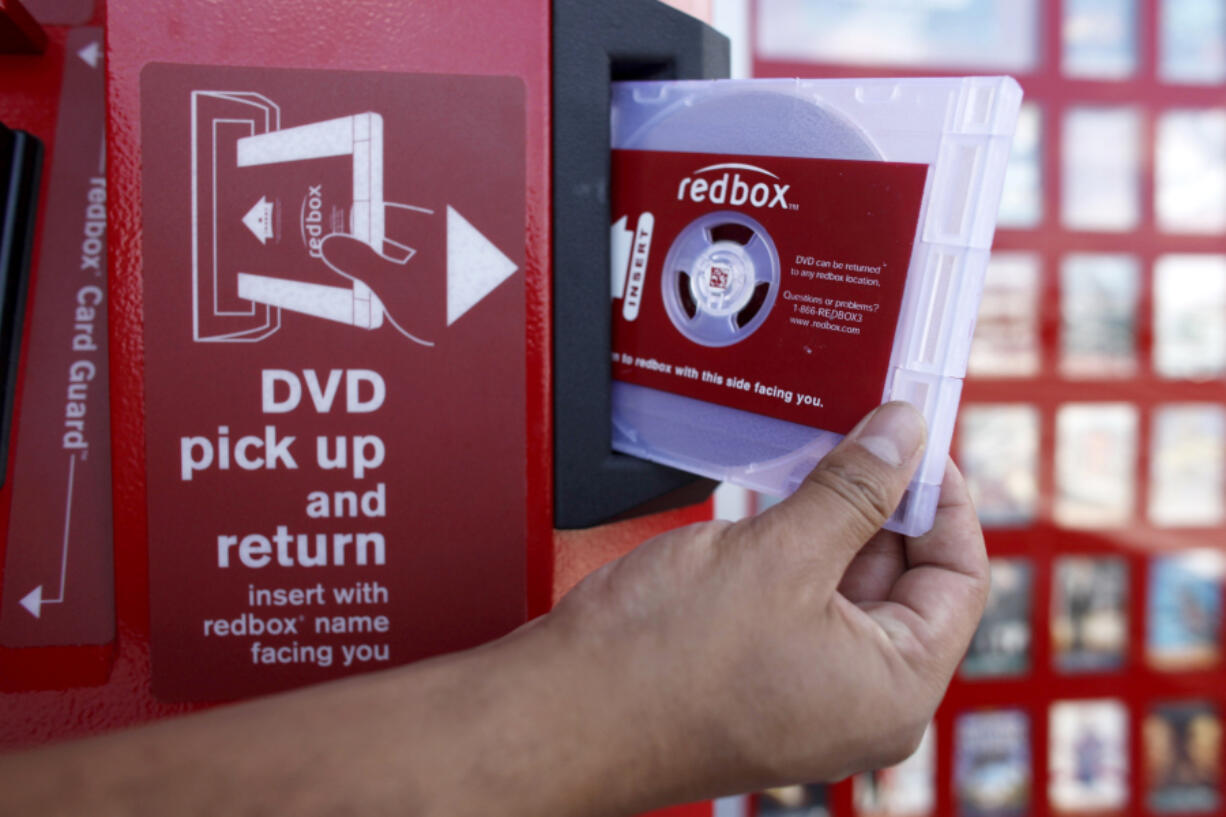 FILE - A rental DVD is dispensed from a Redbox at a 7-Eleven in Los Angeles on August 7, 2009. Chicken Soup for the Soul Entertainment, the owner of DVD rental operator Redbox, filed for Chapter 11 bankruptcy protection, Friday, June 28, 2024.