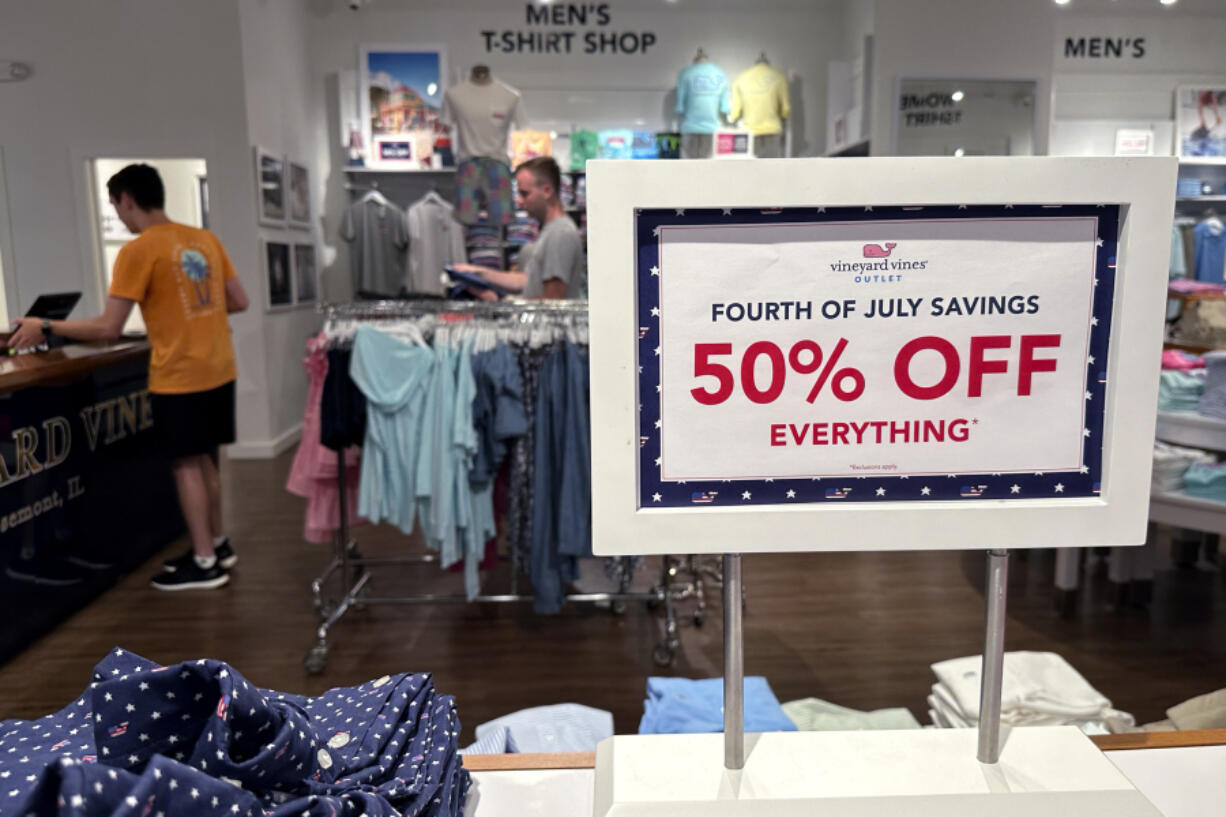 FILE - A holiday sale sign is displayed at a retail store in Rosemont, Ill., June 25, 2024. On Tuesday, July 16, 2024, the Commerce Department releases U.S. retail sales data for June. (AP Photo/Nam Y.