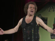 FILE - Richard Simmons speaks to the audience before the start of a summer salad fashion show at Grand Central Terminal in New York on June 2, 2006. Simmons, a fitness guru who urged the overweight to exercise and eat better, died Saturday, July 13, 2024, at the age of 76.