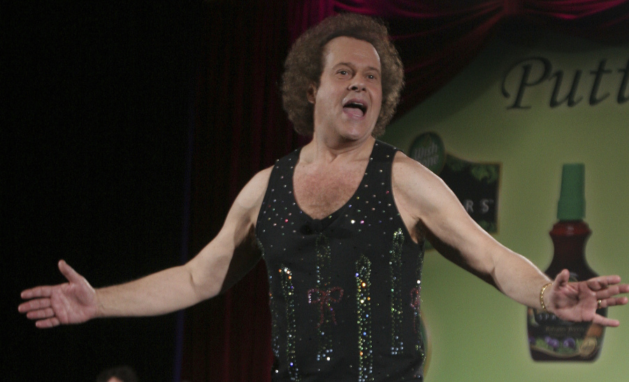 FILE - Richard Simmons speaks to the audience before the start of a summer salad fashion show at Grand Central Terminal in New York on June 2, 2006. Simmons, a fitness guru who urged the overweight to exercise and eat better, died Saturday, July 13, 2024, at the age of 76.