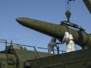 FILE - In this photo released by the Russian Defense Ministry Press Service on Feb. 2, 2024, Russian troops load an Iskander missile onto a mobile launcher during drills at an undisclosed location in Russia. Hawks in Russia have called for revising the country&rsquo;s nuclear doctrine to lower the threshold for using nuclear weapons, and President Vladimir Putin said the doctrine could be modified.