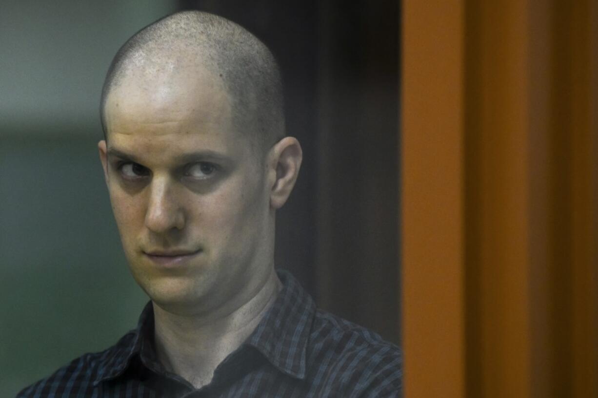 Wall Street Journal reporter Evan Gershkovich stands in a glass cage in a courtroom in Yekaterinburg, Russia, Wednesday, June 26, 2024. Fifteen months after he was arrested in the city of Yekaterinburg on espionage charges, Gershkovich returns there for his trial starting Wednesday, June 26, 2024, behind closed doors. Gershkovich, his employer and the U.S. government deny the charges.