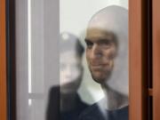 Wall Street Journal reporter Evan Gershkovich stands listening to the verdict in a glass cage of a courtroom inside the building of &ldquo;Palace of justice,&rdquo; in Yekaterinburg, Russia, on Friday, July 19, 2024. A Russian court convicted Gershkovich on espionage charges that his employer and the U.S. have rejected as fabricated. He was sentenced to 16 years in prison after a secretive and rapid trial in the country&rsquo;s highly politicized legal system.