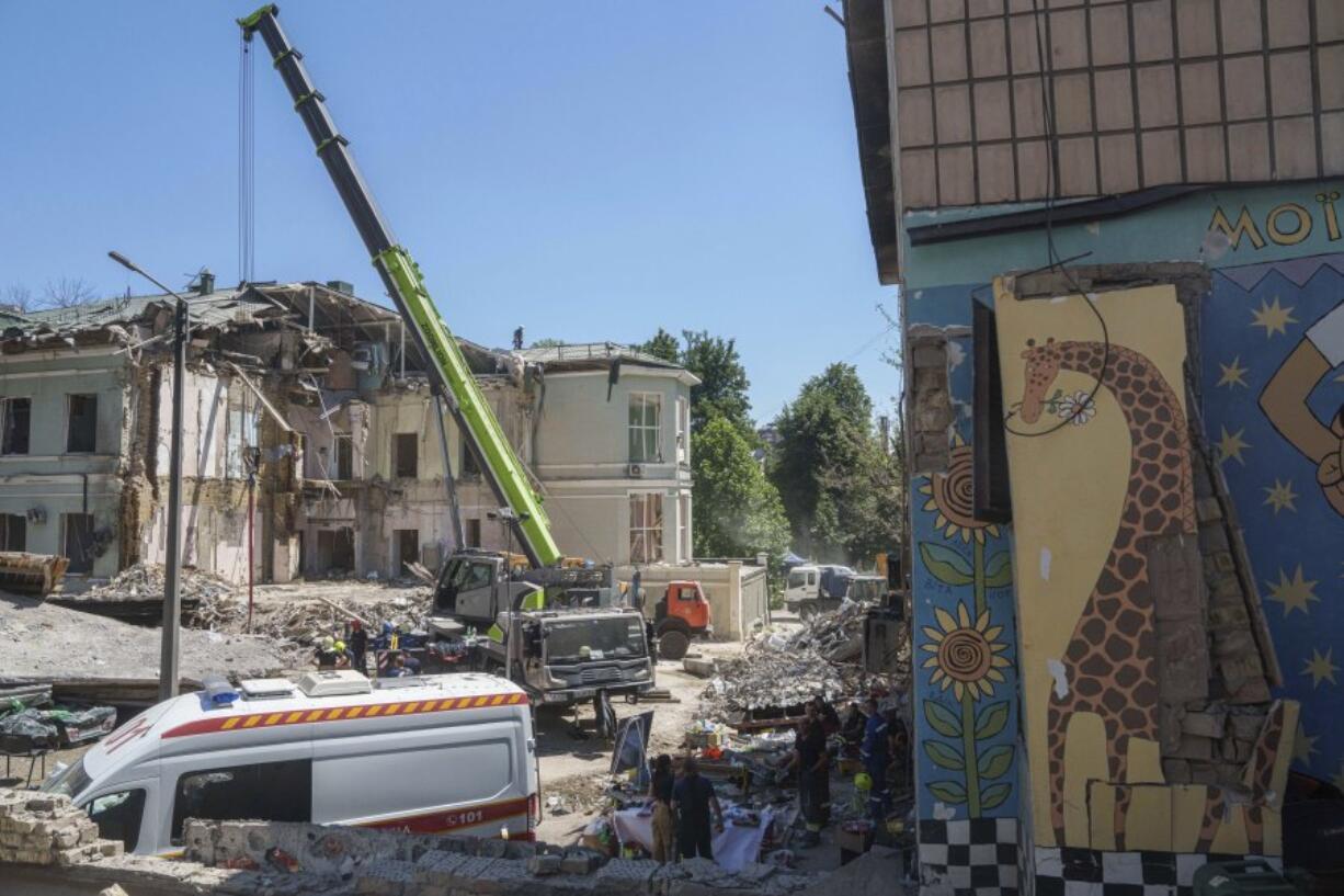 Rescue workers clear the rubble at the site of Okhmatdyt children&rsquo;s hospital hit by Russian missiles on Monday, in Kyiv, Ukraine, Tuesday, July 9, 2024.