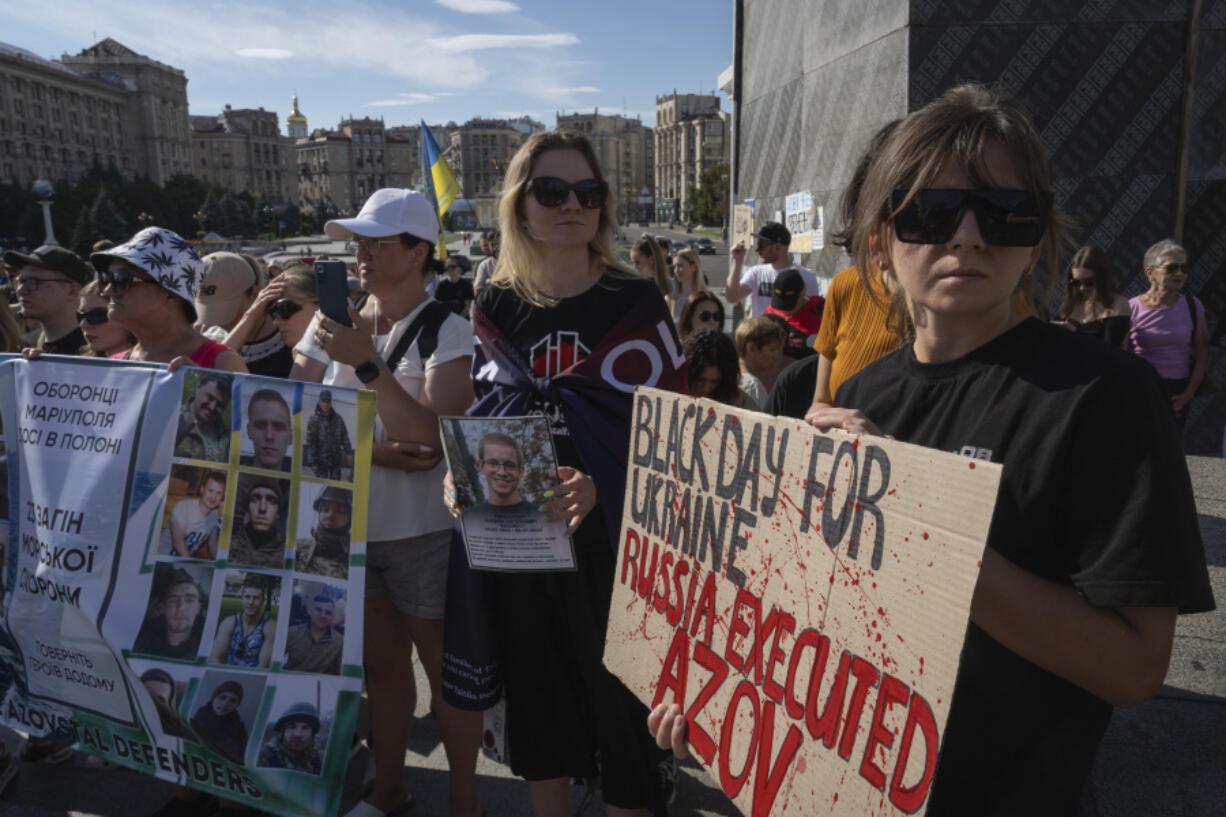 People attend a rally demanding to free Ukrainian prisoners of war who are held in captivity in Russia, at Independence Square in Kyiv, Ukraine, Sunday, July 28, 2024. Several thousand people and soldiers gathered to commemorate the second anniversary of a Russia-orchestrated explosion that killed more than 50 Ukrainian prisoners of war in the Russian-held Olenivka prison barracks.