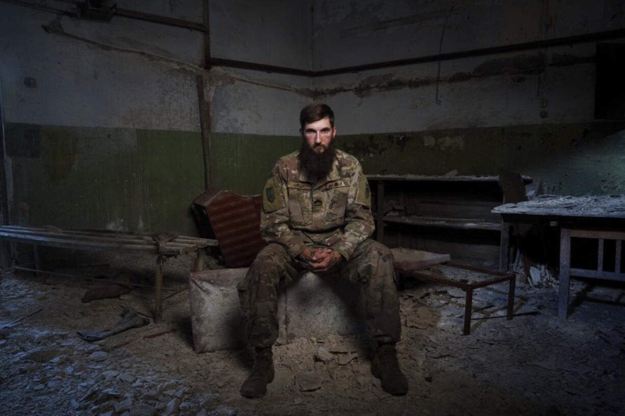 Sgt. Kyrylo Masalitin, known as Maslo, who survived the explosion at the Russian-controlled Olenivka prison two years ago that killed more than 50 Ukrainian POWs, sits for a portrait in Lyman, Donetsk region, Ukraine, Thursday, July 11, 2024. &ldquo;In front of my eyes, there were guys who were dying, who were being revived, but it was all in vain,&rdquo; said Masalitin.