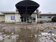 A puddle of water remains at the entrance of the Springs Creekside Nursing and Rehabilitation in Yellville, Ark., after the residents were evacuated due to flooding on Wednesday, July 17, 2024.