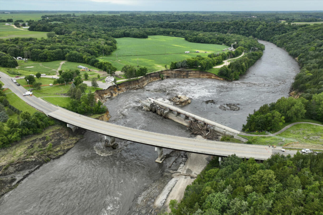 Floodwater continues to carve a channel around the Rapidan Dam on June 27 near Mankato, Minn.