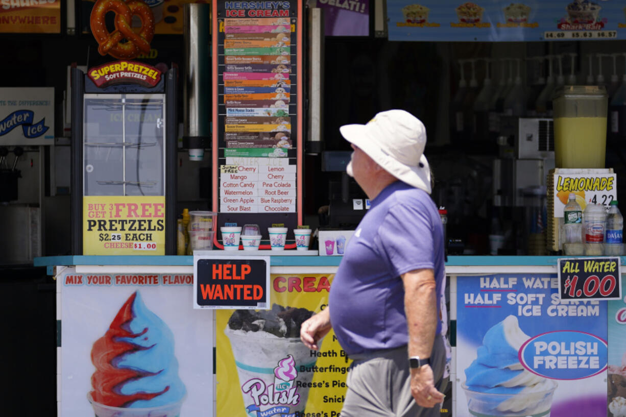 FILE - A person walks past an ice cream stand on the boardwalk, Thursday, June 2, 2022, in Ocean City, N.J. A type of bankruptcy protection filing that made it easier for small businesses to seek relief has expired, which will complicate filing for small businesses with more than $3 million in debt.